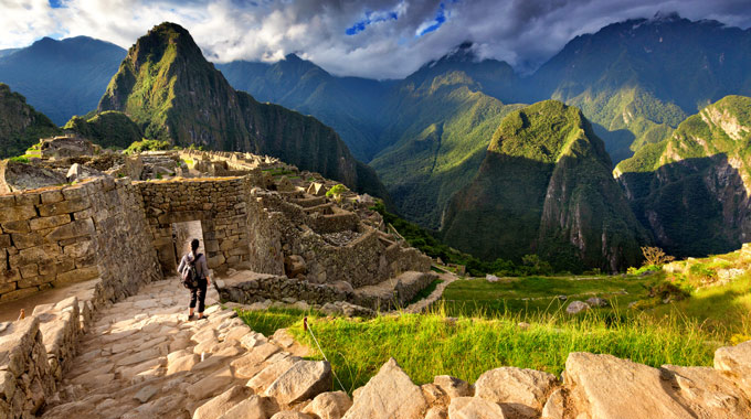 A traveler exploring Machu Picchu in Peru